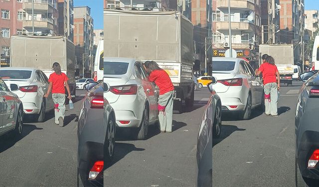 Yaşıtları okul hazırlığı yaparken o ışıklarda cam silip para kazanmaya çalışıyor